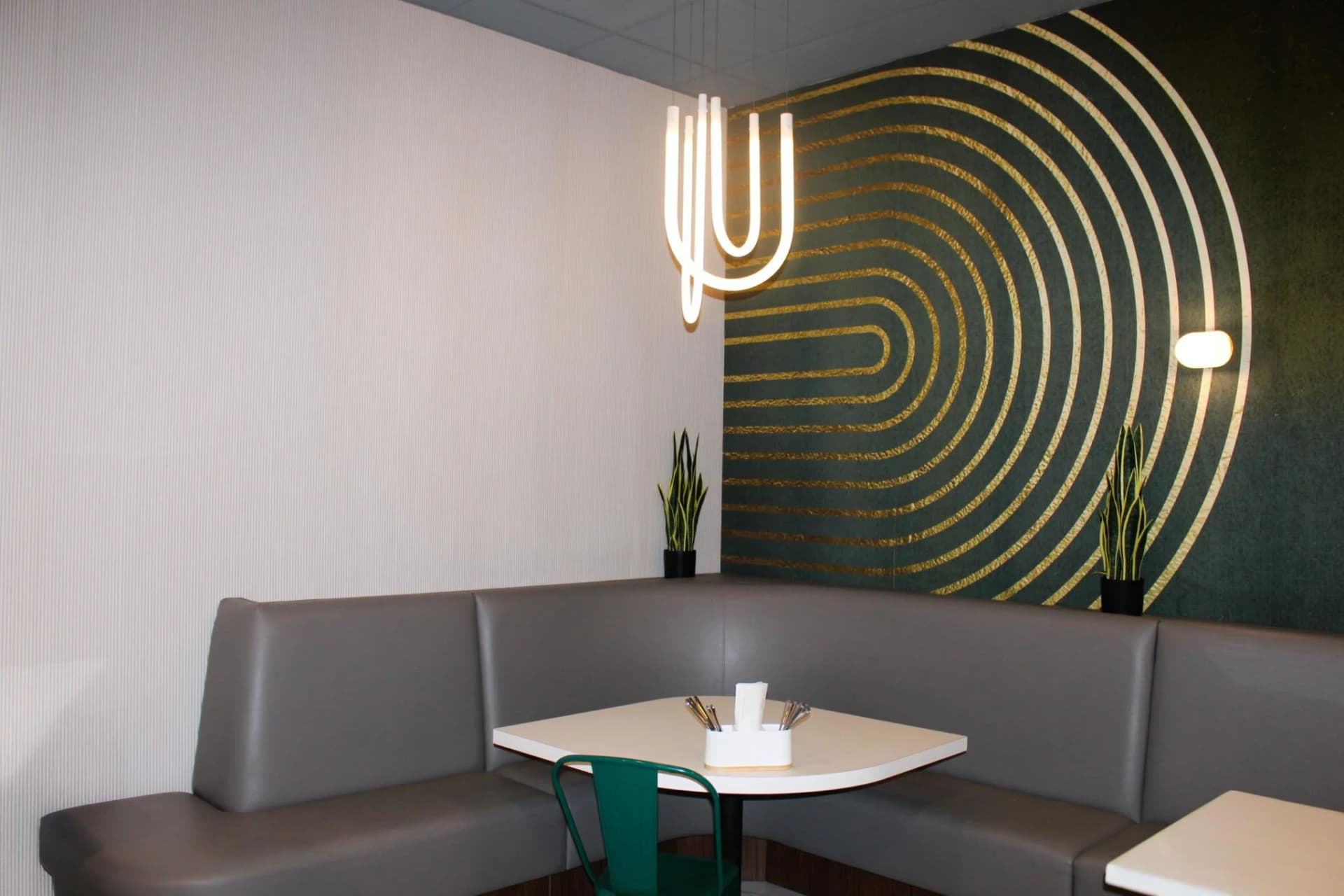PiddeG Restaurant — gold pattern wall with modern pendant light
