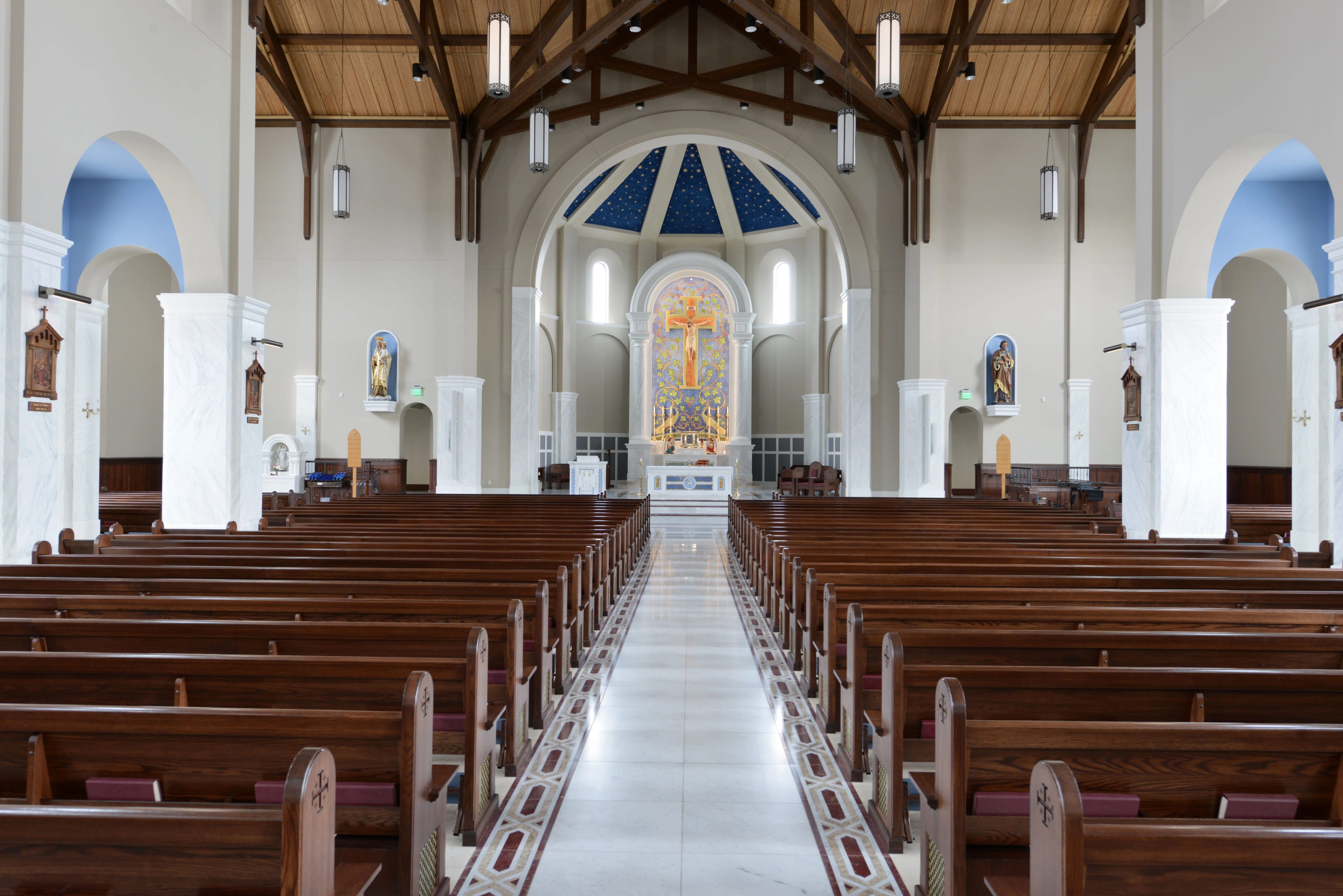 Holy Cross Church — Romanesque-inspired sacred architecture with timber trusses and celestial apse by YCD Studio