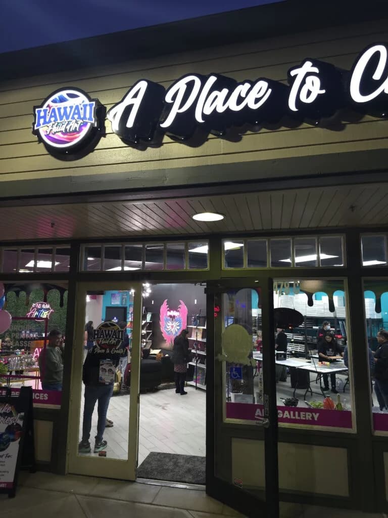 Hawaii Fluid Art — illuminated storefront at night