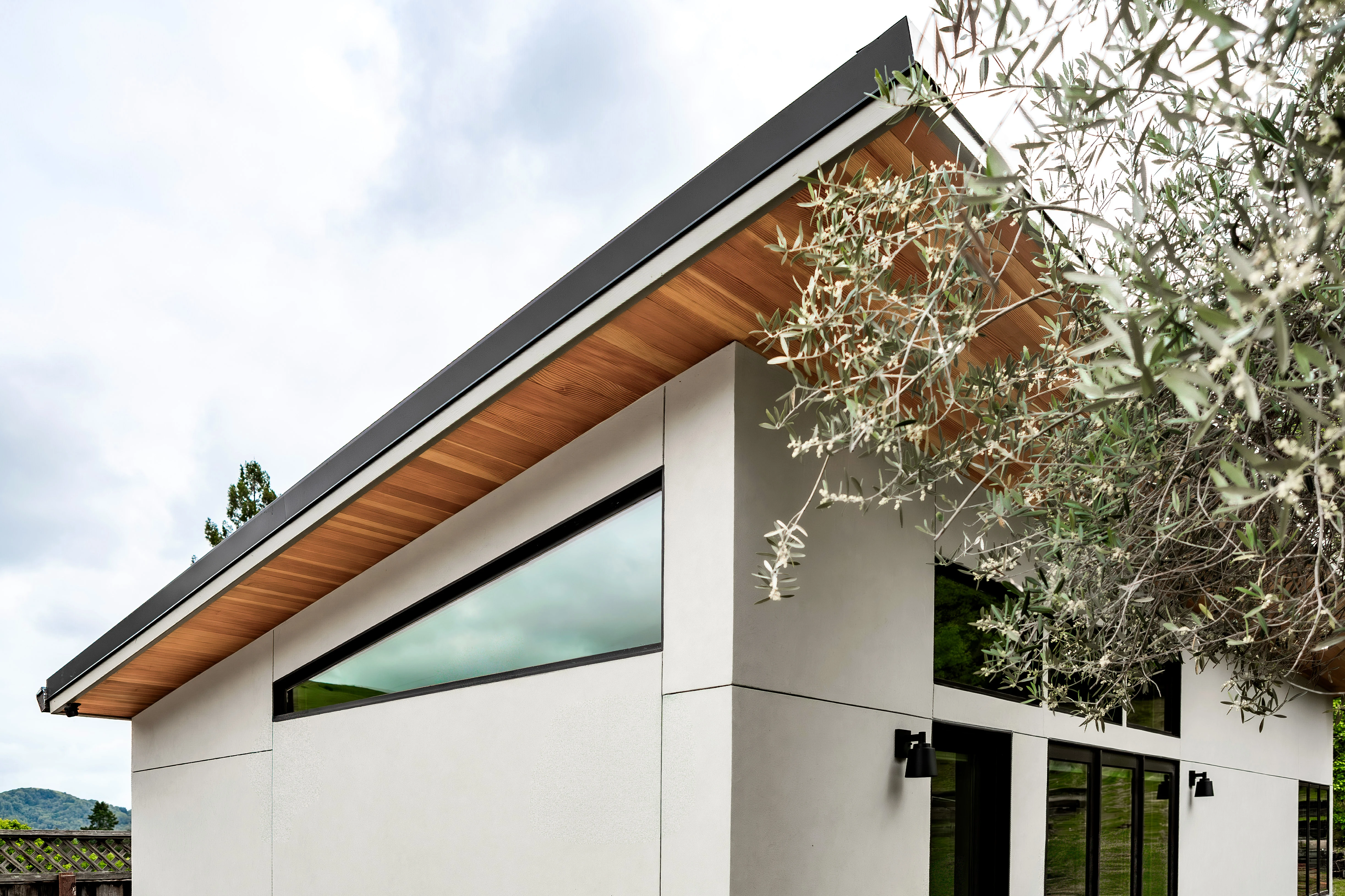 The cantilevered roof and wood soffit